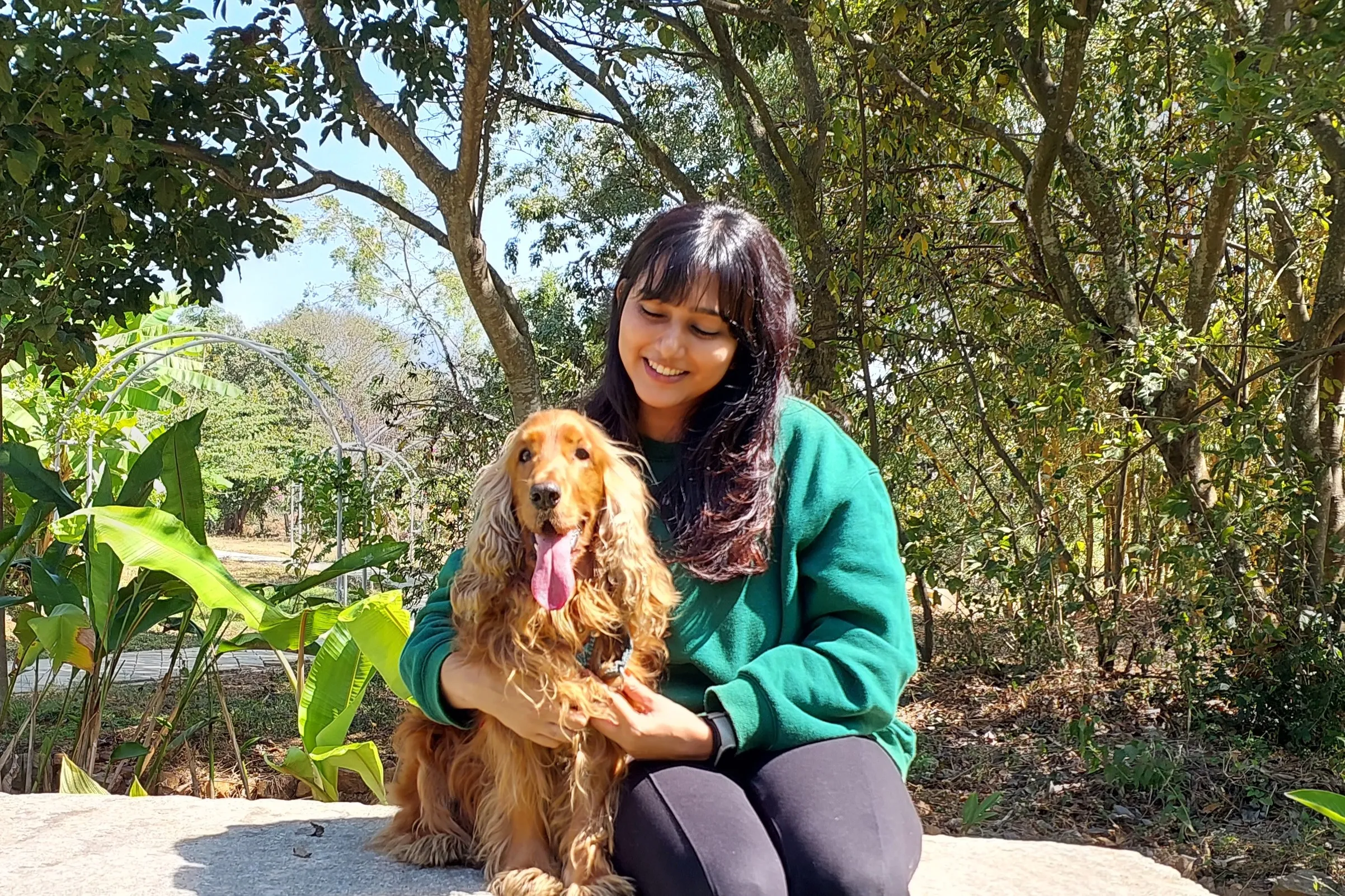 A picture of Shivani with her dog